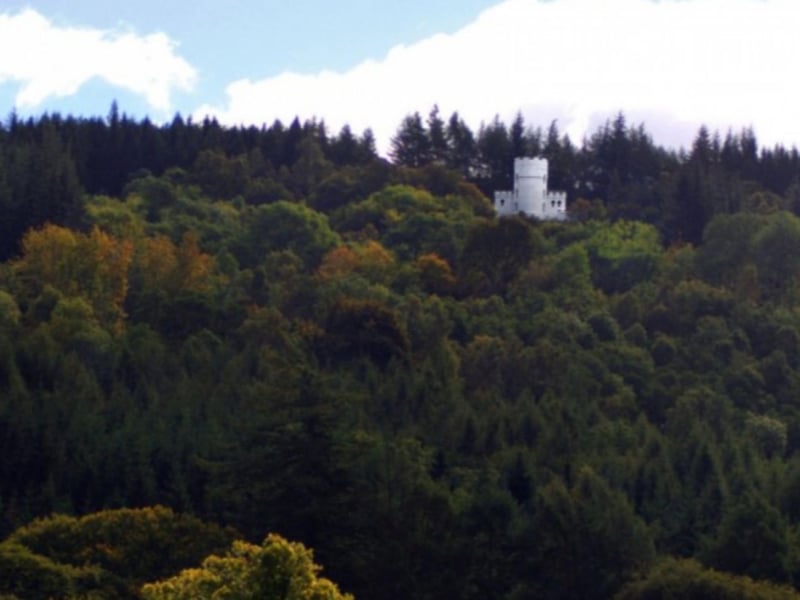 The tower is surrounded by Highland woodland.