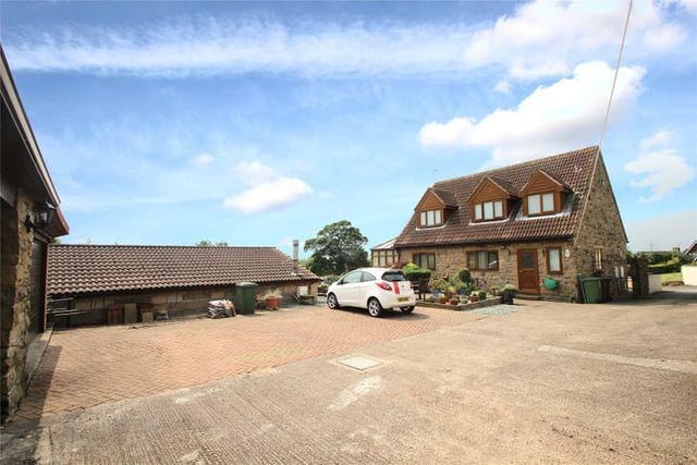 This three bedroom bungalow has an indoor heated swimming pool and a balcony with views.