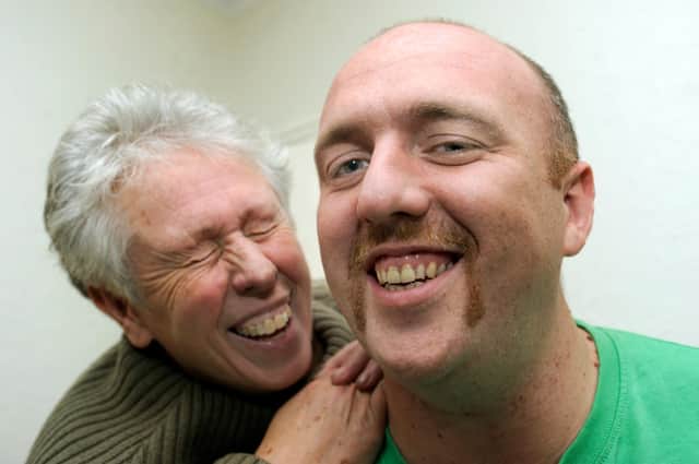 Pictured is James Raistrick of Robin Lane, Beighton,who took part in Movember in 2011 to raise cash for the palliative care ward in Sheffield in memory of his Dad Andy a former City policeman who died. Pictured with James his is Mum Sue