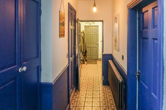 This hallway connects every room on the ground floor. Including the lounge and kitchen and two cupboards, a downstairs loo and a porch to the side door.