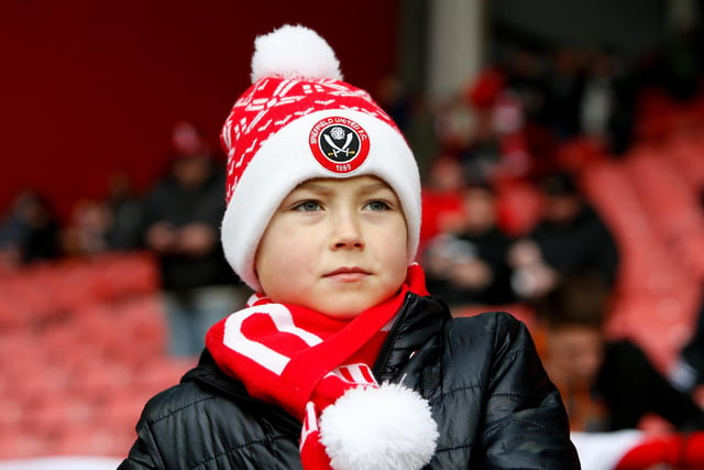 A youngster before the game with Brighton & Hove Albion at Bramall Lane last February.