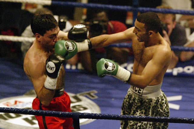 Naseem Hamed of Great Britain lands a right hand during the IBO Featherweight Championship of the World fight against Manuel Calvo of Spain at the London Arena on May 18, 2002. (Photo by Mark Thompson/Getty Images)