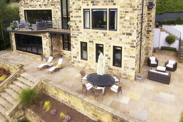 The landscaped gardens provide a private area for children to play or for al fresco family meals, with the large stone terrace offering a sociable space to sit out.