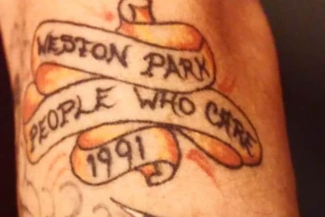 Glynn's tattoo reads 'Weston Park people who care 1991'