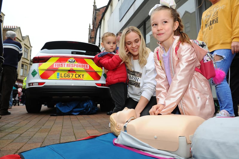 Logan Kidd, 3, Amanda Kidd, 27, and Caisi Van Vuuren, 7, from Falkirk learn some life saving skills.