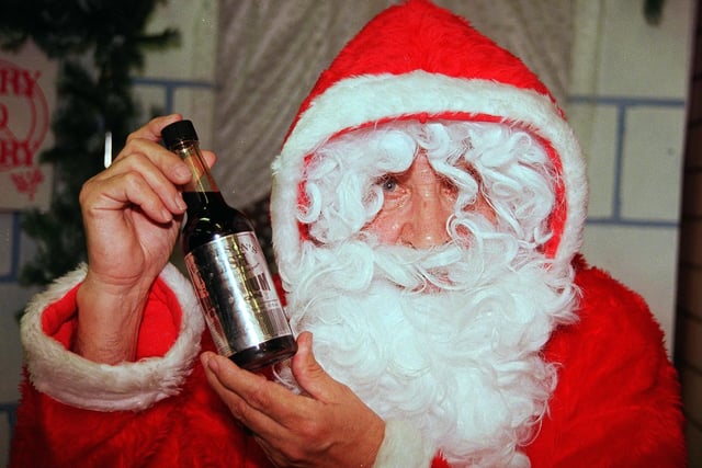 Silver labels for the Millennium for Henderson's Relish, admired by Santa at Castle House, Angel Street in 1999