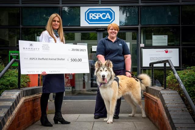 The cheque is presented to RSPCA Sheffield Service Manager Dawn Sampson.