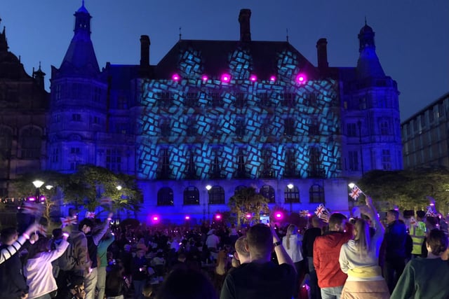 Lights, lasers and projections transformed the iconic building, as revellers waved union jacks. Pic: The Steel City Snapper
