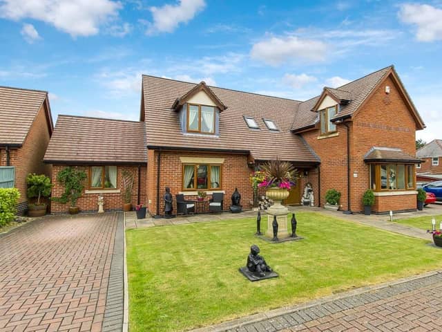 The property is described as an 'extended, five-bedroom, detached family home on gated development'.
