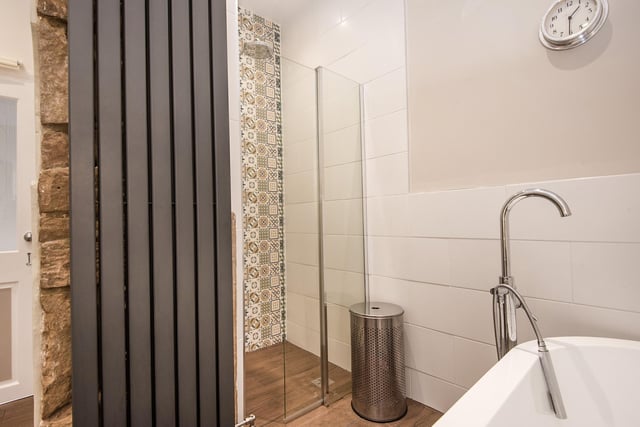 The luxurious family bathroom has a freestanding bath and a wet room-style shower - it is also smart home enabled, to allow voice-controlled lighting with Amazon Alexa or Google Home.