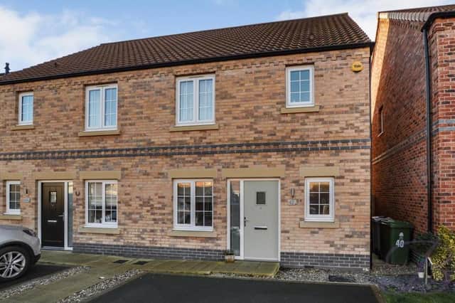 This gorgeous three-bedroom, semi-detached house on Kingfisher Way, Ollerton is on the market for at least £200,000. The front of the property includes a Tarmacked area suitable for off-street parking.