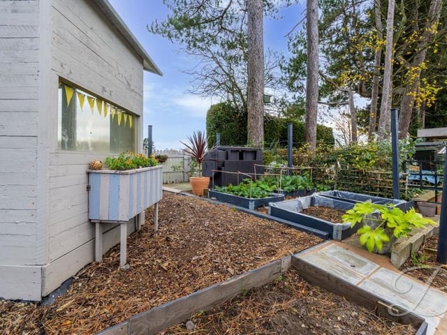 At the top end of the back garden is this handy storage shed and an area where you could possibly grow vegetables.