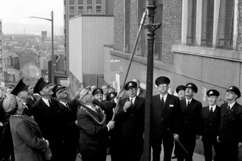 Lord Provost of Glasgow Sir Donald Liddle lights the last Glasgow gas street lamp in September 1971.