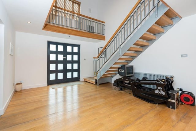 Upon entry to the home you immediately notice the high ceilings and expansive space.
