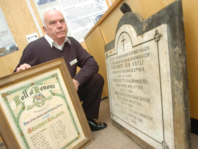 Doncaster Museum's visitor assistant Steve Tagg with the Walden Stubbs war memorial plaque which was donated by a farmer from the village
