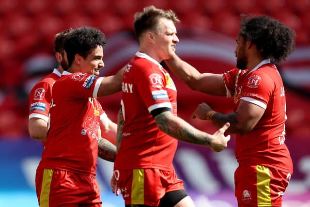 DONCASTER, ENGLAND - APRIL 04: Izaac Farrell (L) of Sheffield Eagles celebrates with team mates after scoring their side's seventh try during the Betfred Championship match between Sheffield Eagles and Bradford Bulls at Keepmoat Stadium on April 04, 2021 in Doncaster, England.Sporting stadiums around the UK remain under strict restrictions due to the Coronavirus Pandemic as Government social distancing laws prohibit fans inside venues resulting in games being played behind closed doors. (Photo by George Wood/Getty Images)