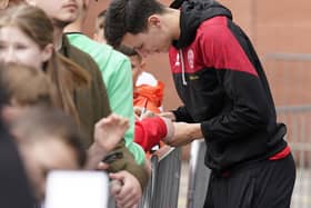 Anel Ahmedhodzic of Sheffield United signs autographs for the fans: Andrew Yates / Sportimage