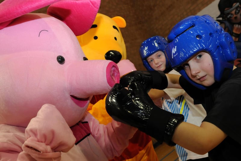 Piglet and Winnie the Pooh come face to face with Leykuindo Kickboxer's Callum Lydon and Shane Elliott at a family day at Lukes Lane Community Centre in 2011.