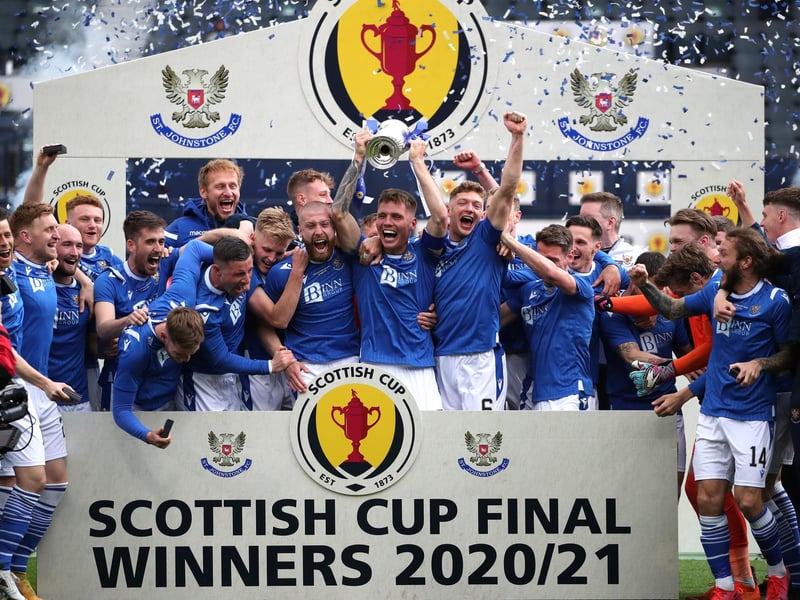 St Johnstone's Jason Kerr lifts the trophy and celebrates with the rest of the team after the final whistle during the Scottish Cup final match at Hampden Park, Glasgow