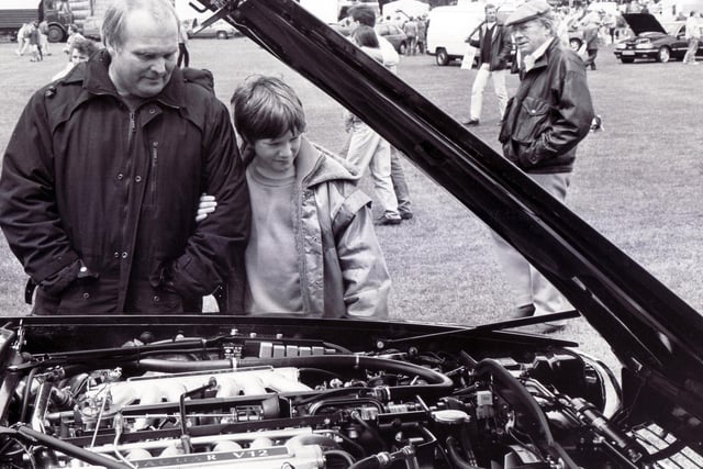 Mr Don Fairey and his son Ian, aged 10, of Sheffield, are pictured inspecting the shiny engine of a Jaguar XJS V12 on show by Hatfields of Sharrow Lane, Sheffield, at the Gala in 1991