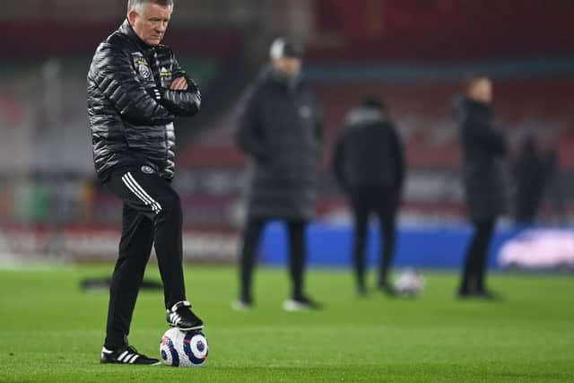 Chris Wilder, Manager of Sheffield United looks on during the warm up prior to the Premier League match between Sheffield United and Liverpool at Bramall Lane . (Photo by Shaun Botterill/Getty Images)