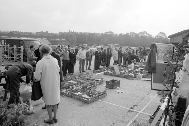 Fruit and vegetables were sold alongside the cattle - van you spot yourself amongst the eager shoppers?