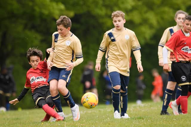 Action from Paulsgrove Black under-13s (red) Mid Solent Youth League under-13 C Division meeting with Lee Rangers White. Picture: Keith Woodland (080521-414)