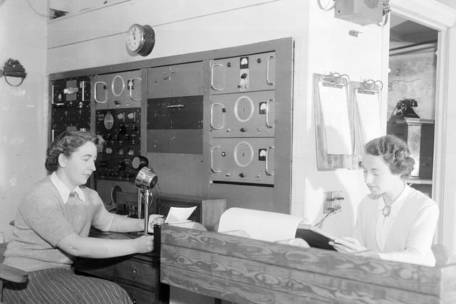 Taking calls at the police wireless station at Blackford Hill in March 1952.