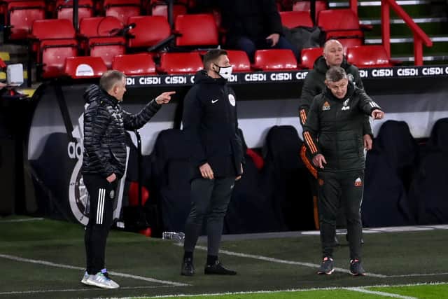 Sheffield United manager Chris Wilder (left) shows he has plenty of fight left in him as he exchanges words with Manchester United manager Ole Gunnar Solskjaer: Laurence Griffiths/PA Wire.