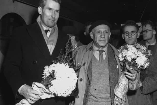 Pablo Picasso (right) and Albert De Charmbru holding bunches of flowers as they arrive in Sheffield. Picture: J. Wilds/Keystone/Getty Images.