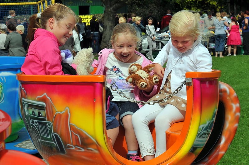 Eboney and Sienna Williams with Libbie Frostick enjoying the spinning teacups ride at the Friends of Ward Jackson Park annual fun day in 2011.