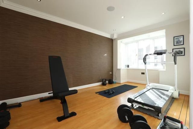 The family room is found at the front of the property. It is currently being used as a home gym.
