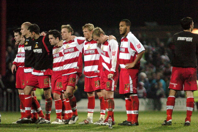 The tension is too much for Rovers skipper Steve Foster (far right) whilst his teammates watch the penalty shootout.