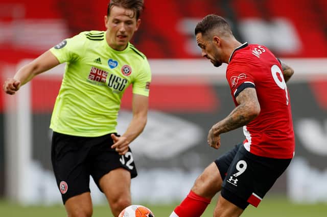 Danny Ings of Southampton  is put under pressure by Sander Berge of Sheffield United (Photo by Andrew Boyers/Pool via Getty Images)