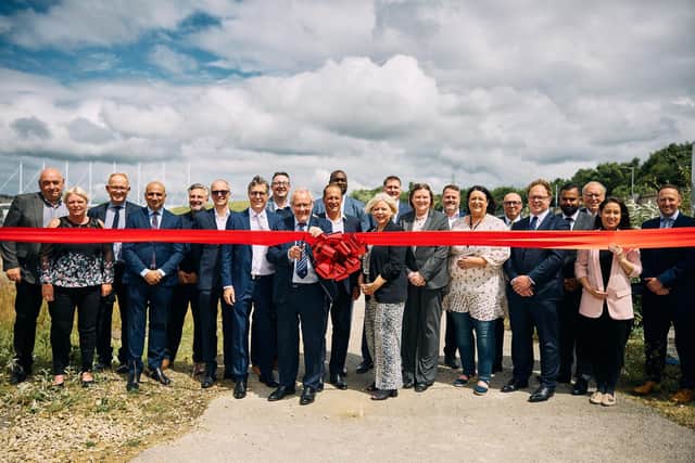 Richard Caborn (Chair of Sheffield Olympic Legacy Park) cuts the ribbon for the construction site of Park Community Arena.