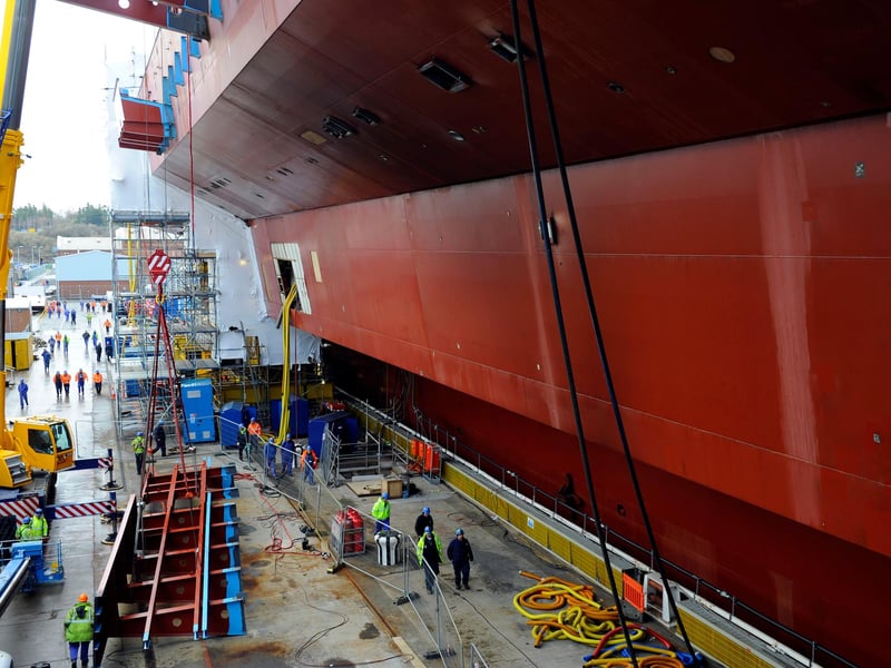 Ship builders in Rosyth worked to put together the separate pieces of HMS Queen Elizabeth which had been built across the country, including in her future home Portsmouth. Picture: Allan Hutchings (123920-260)