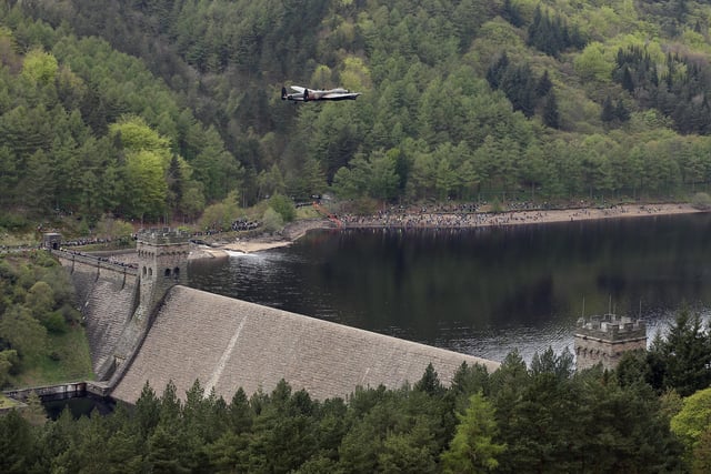 A Lancaster bomber flies over Ladybower reservoir in the Peak District to mark the 70th anniversary of the World War II Dambusters mission on May 16, 2013(Photo by Christopher Furlong/Getty Images)