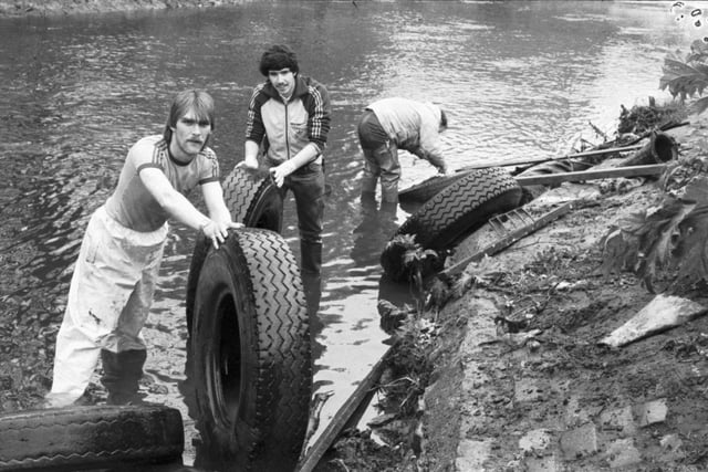 Teenagers helping to clean up the Water of Leith remove abandoned tyres from the river during Operation Riverbank in May 1983.