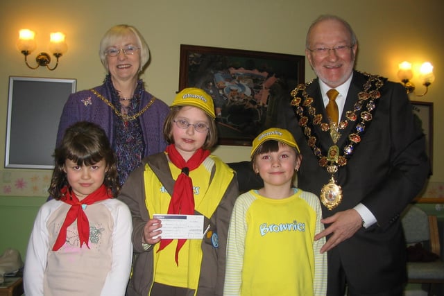 The Mayor and Mayoress of Chesterfield, Cllrs Keith and Glenys Falconer presented a cheque to Staveley Brownies (l-r) Brownies Georgina Millen, Becky Miles and Bridget Kaye in 2006