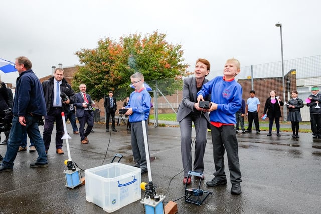 Helen Sharman takes time to help Max Nicholson launch his rocket at High Tunstall College of Science.