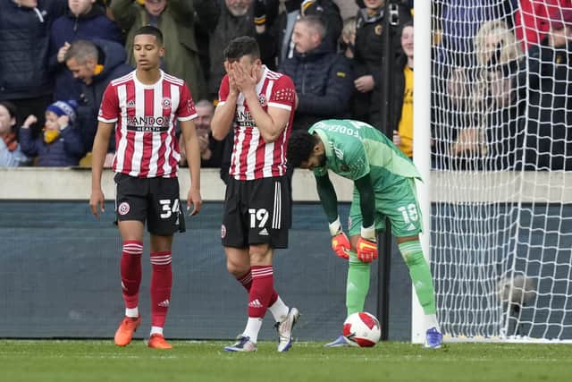 Jack Robinson of Sheffield United is distraught following the Wolves' first goal: Andrew Yates / Sportimage