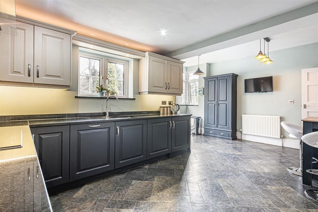 The kitchen has a contemporary finish with a breakfast bar included.