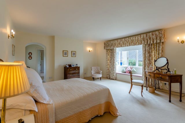 There are eight bedrooms throughout the property in total, with the principal bedroom overlooking the garden and benefiting from its own five piece en-suite bathroom, and a separate dressing area with fitted wardrobes.
