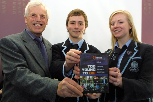 Godfrey Holmes, a volunteer trainer with the FedEx and Brake Road Safety Academy, meets Lady Manners sixth formers and young drivers Roger Wood,18, and Mary Benn,17 before his lecture on road safety.