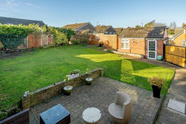 A more elevated view of the rear garden and its seating area. Because it benefits from a south-westerly aspect, you can enjoy the afternoon sunshine.