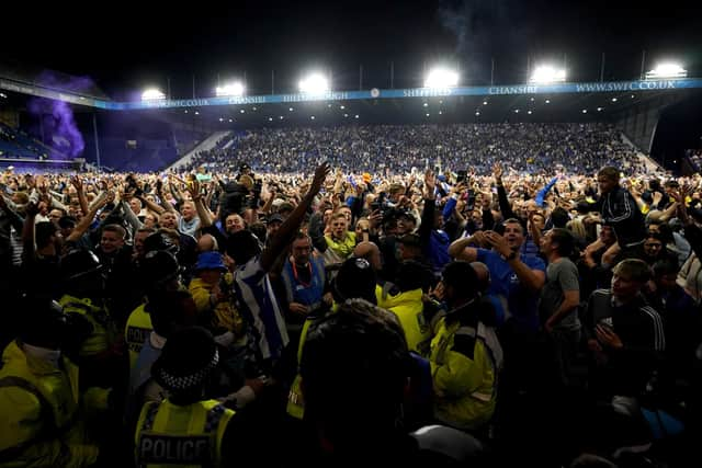 Sheffield Wednesday fans celebrate on the pitch after the Sky Bet League One play-off semi-final second leg. (Nick Potts)