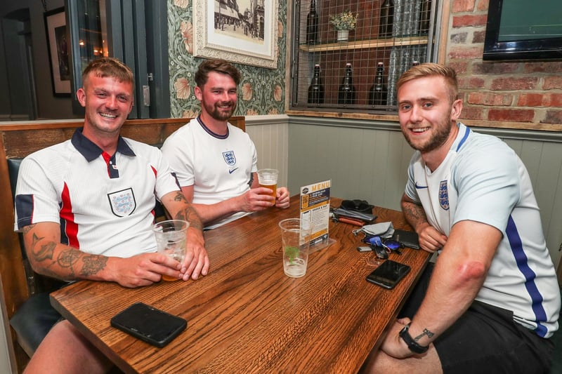 England Fans watching England V Croatia at The Southsea Village. Josh Winsor-Viney, Jame Woodhouse and Tim Shaw. Picture: Stuart Martin (220421-7042)
