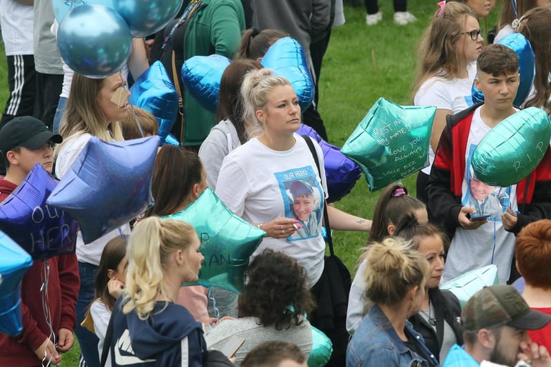 At the memorial event, many people wore t-shirts with Logan's face and the words 'our hero'.