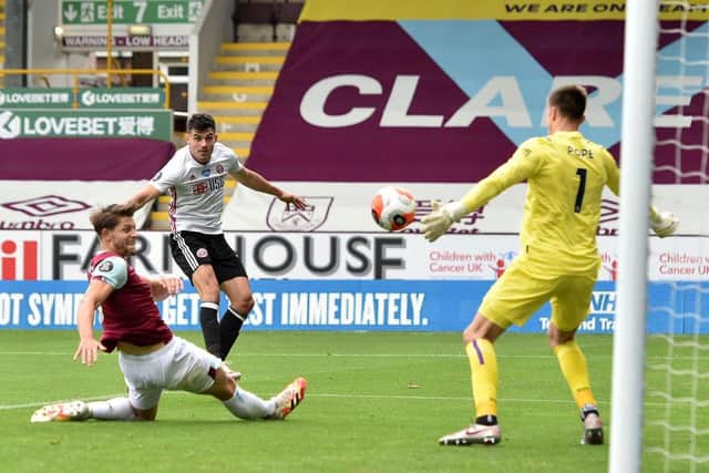John Egan fires home Sheffield United's equaliser in the 1-1 draw against Burnley at Turf Moor this afternoon. (Photo by Peter Powell/Pool via Getty Images)