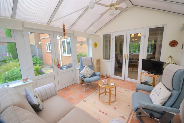 Conservatory - A lovely addition to the property,  this UPVC constructed conservatory with double glazed windows and poly carbonate roof built on a dwarf brick wall, having various power sockets, tv aerial point, warm and cool heater, ceramic tiled floor ceiling fan and french doors open to a patio seating area "perfect for entertaining".